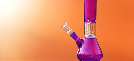 Pink bong in front of an orange background