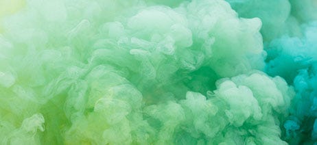 Green and turquoise swirls of smoke