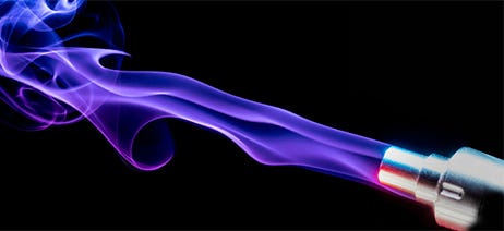blue vapor swirling from a dab pen