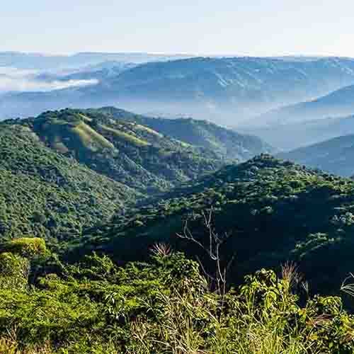 Green mountains fading off into the distance