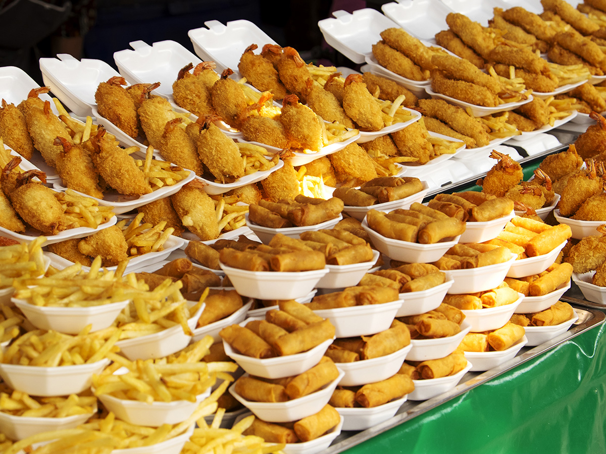 Large table filled with fried foods