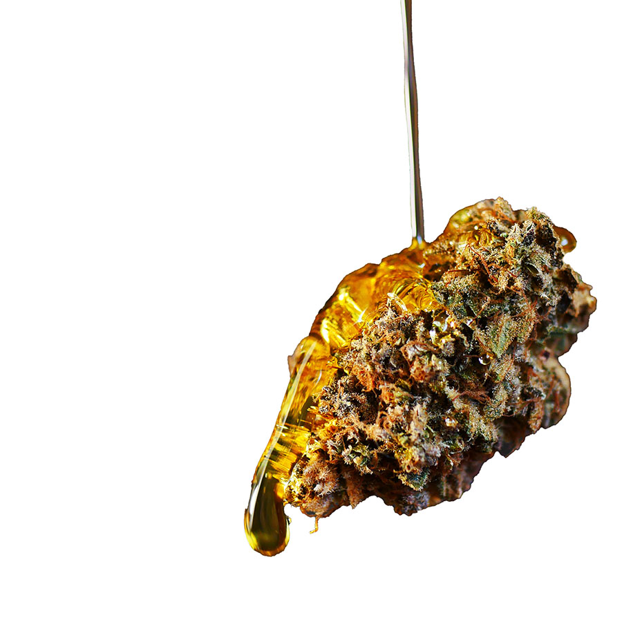 Cannabis flower with distillate dripping onto it