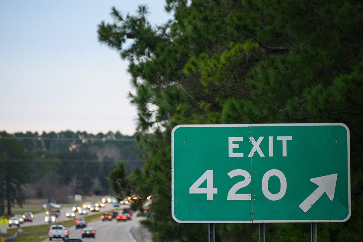 Highway exit sign that reads Exit 420