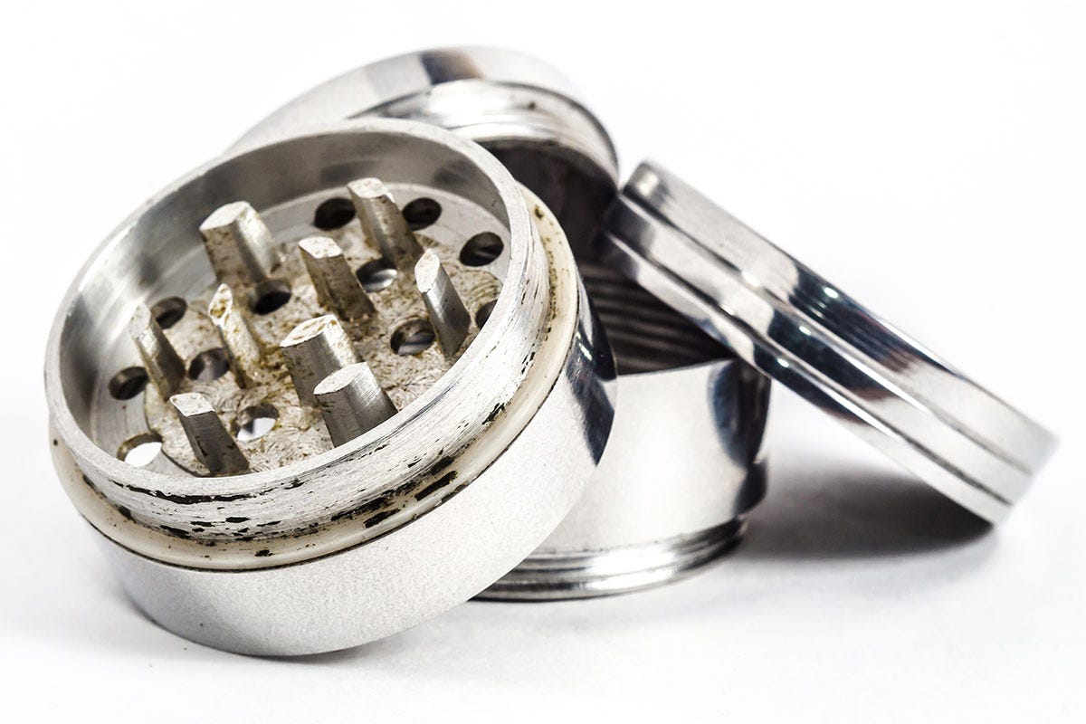 Dirty three-piece cannabis grinder