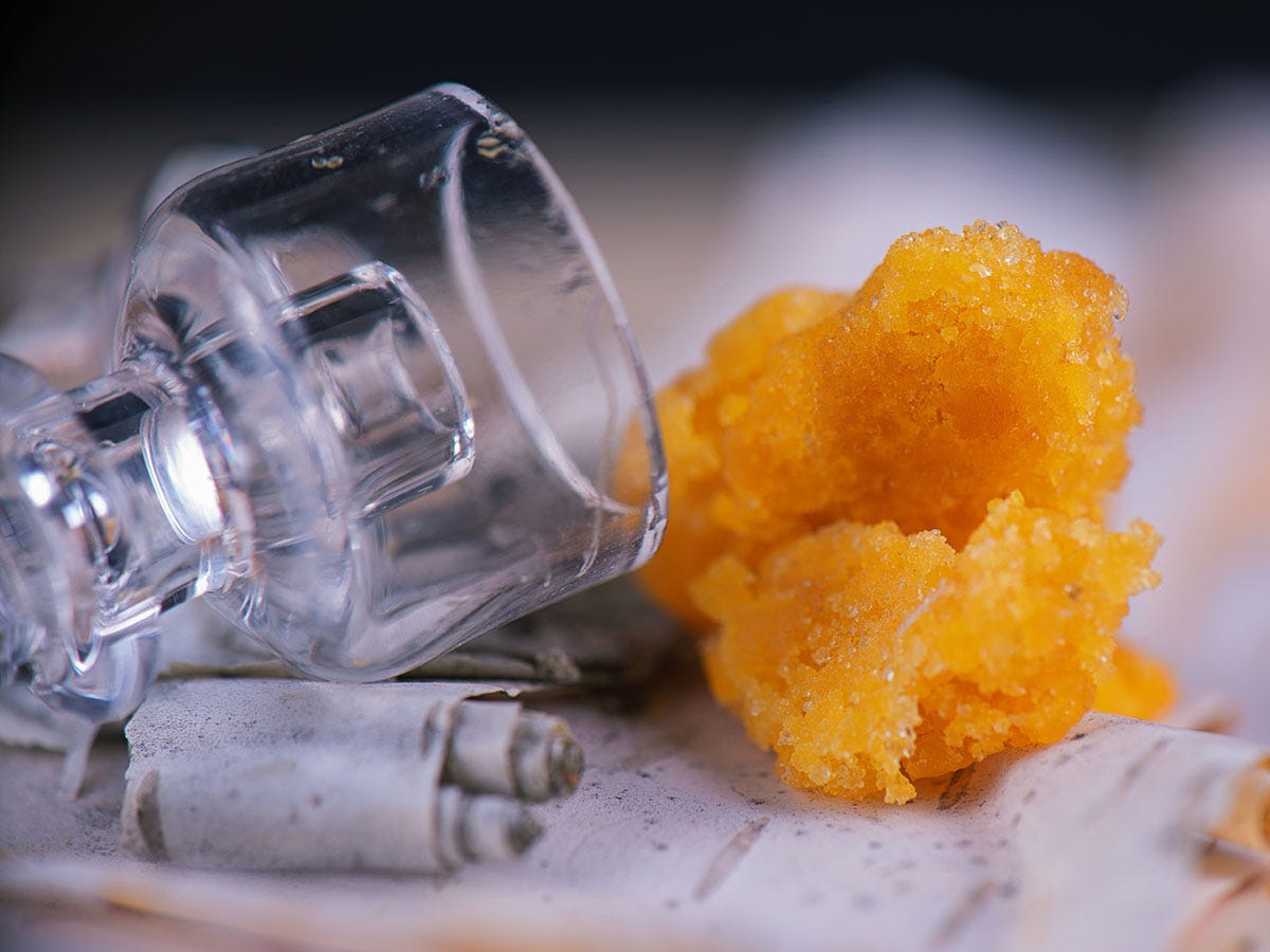 Quartz banger for a dab rig next to cannabis wax