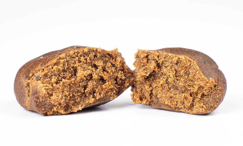 Brick of marijuana hash cut in half