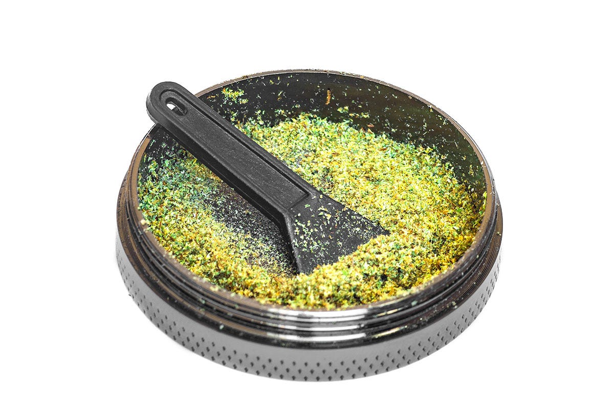 Cannabis kief at the bottom of a marijuana grinder