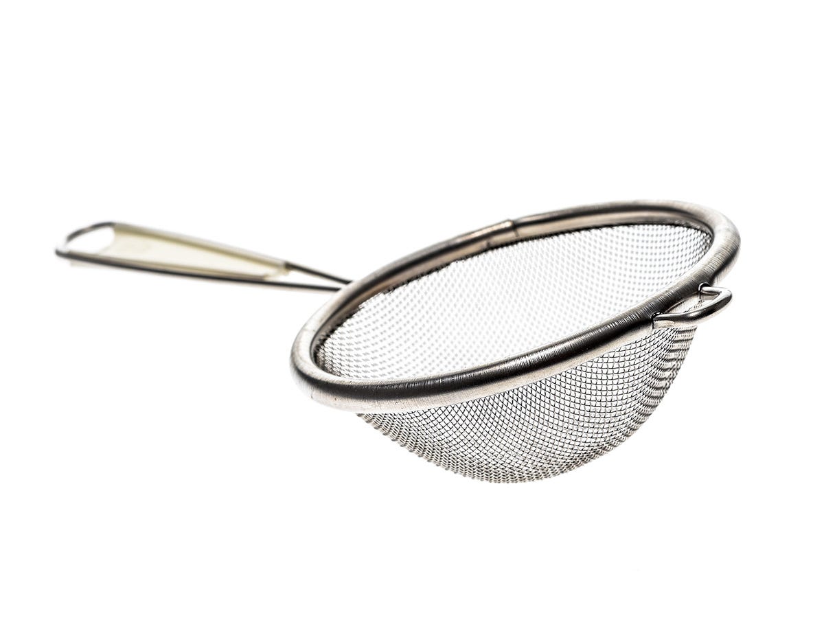 A fine mesh strainer with a handle against a white background