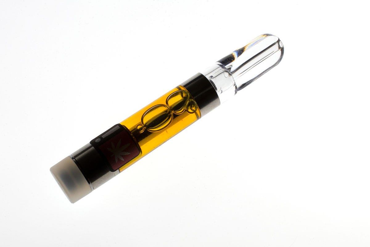 Marijuana vape cartridge on a white background